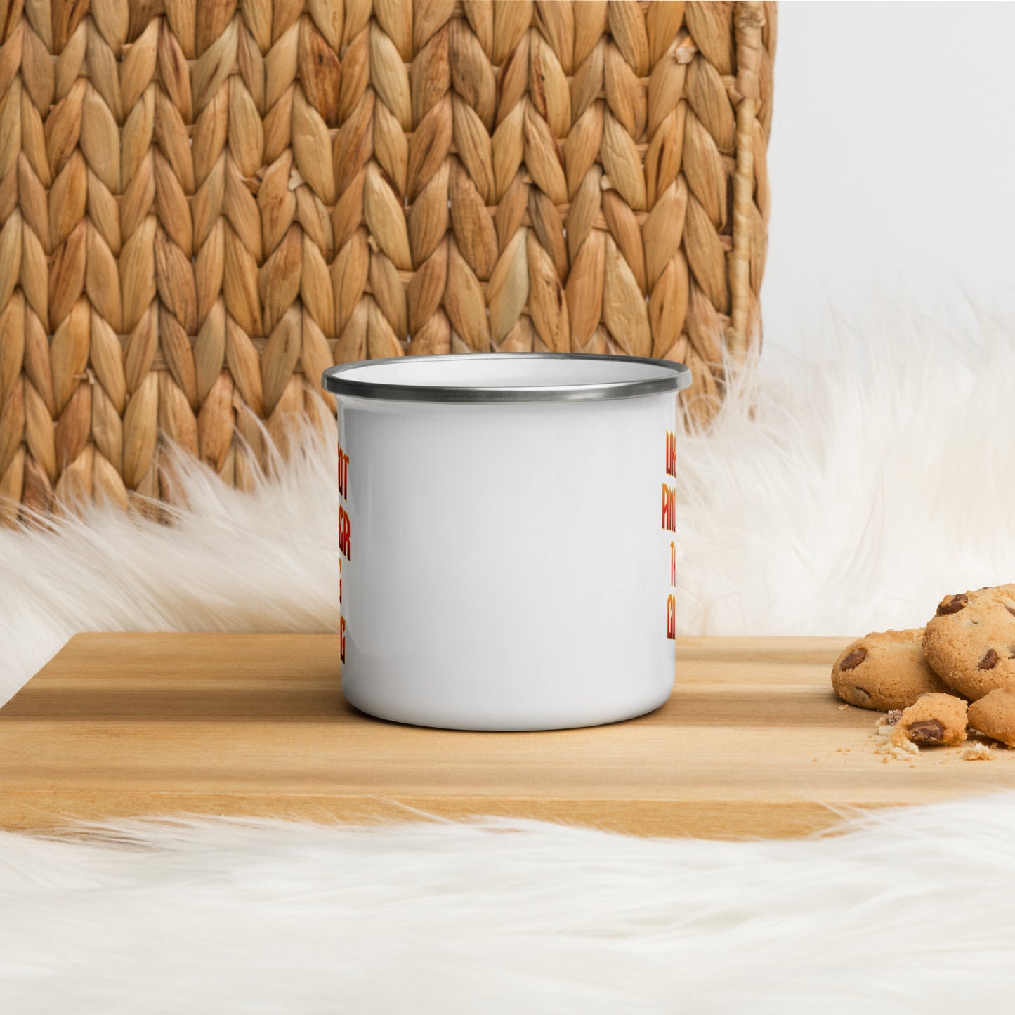 White enamel mug angled to illustrate that ‘Uke Got Another Thing Coming' in orange and yellow slanted block letters is printed on both sides of the mug handle.