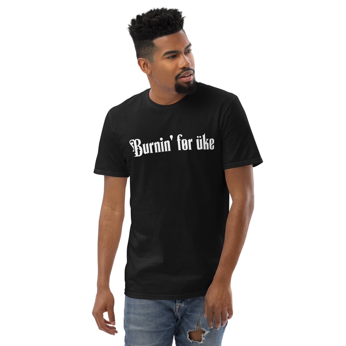 Man wearing a black t-shirt with 'Burnin' for uke' in white Gothic letters printed on it.