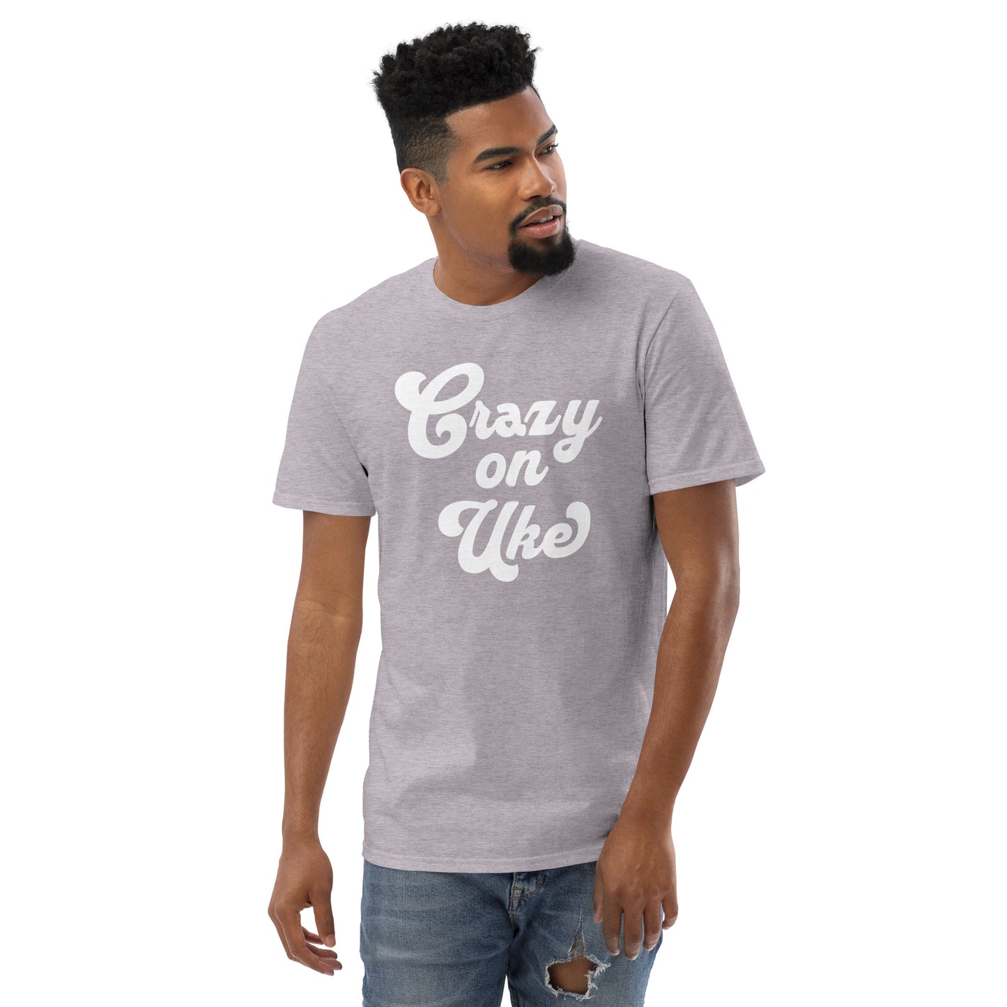 Man wearing a light grey t-shirt with 'Crazy On Uke' in white cursive text.