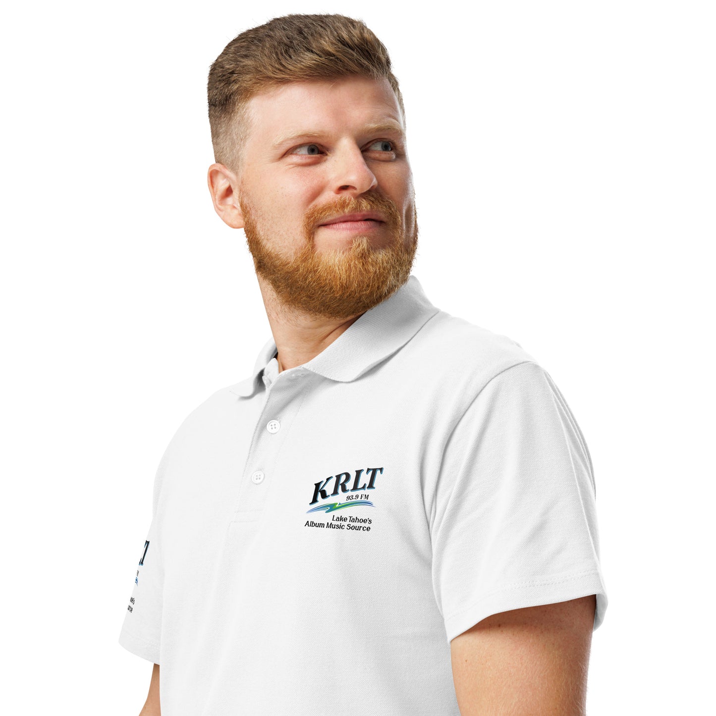 Man wearing a white golf shirt with the KRLT logo in black, blue, and green, placed on the left upper-chest and right sleeve.