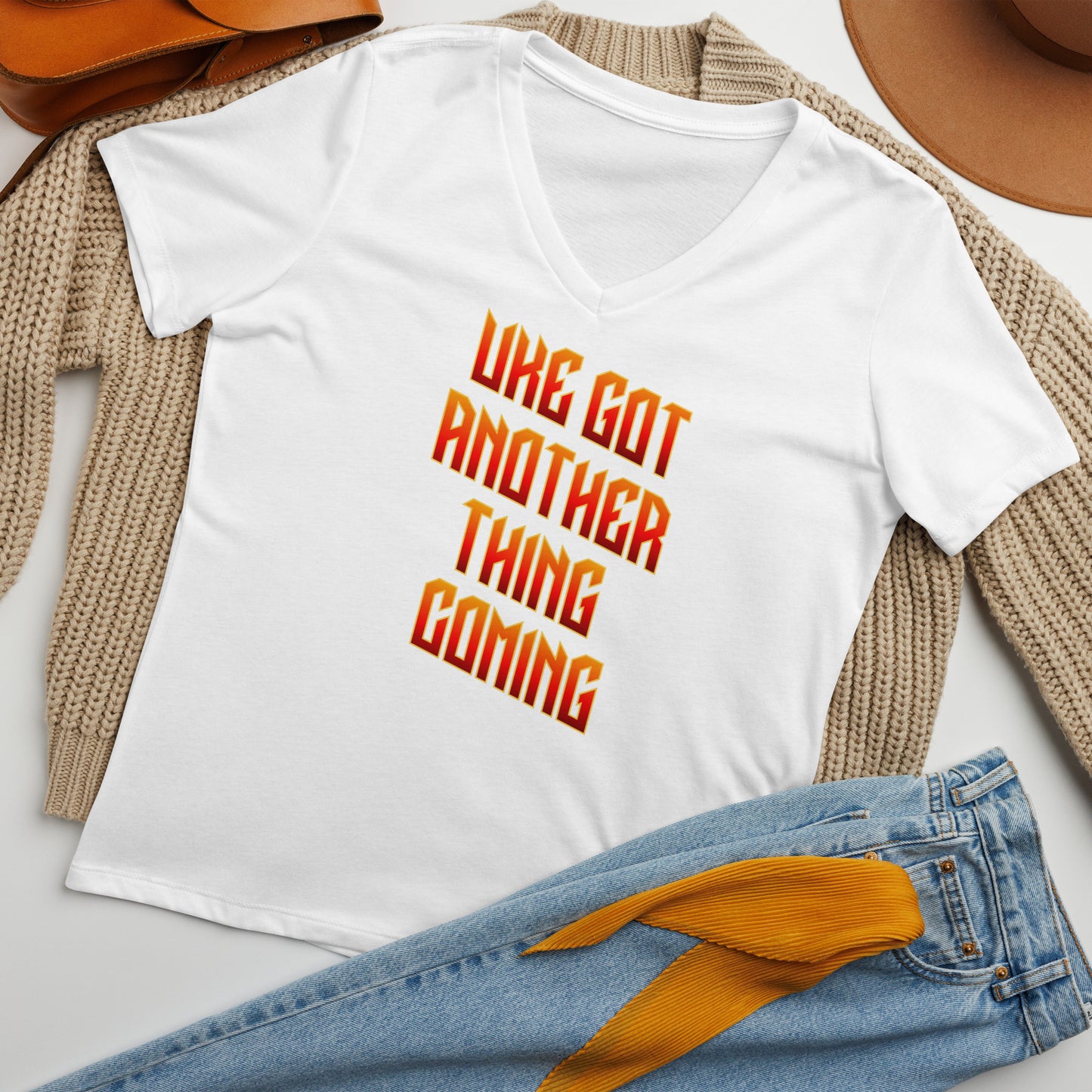 White v-neck t-shirt printed with 'Uke Got Another Thing Coming' in orange and yellow slanted block letters.