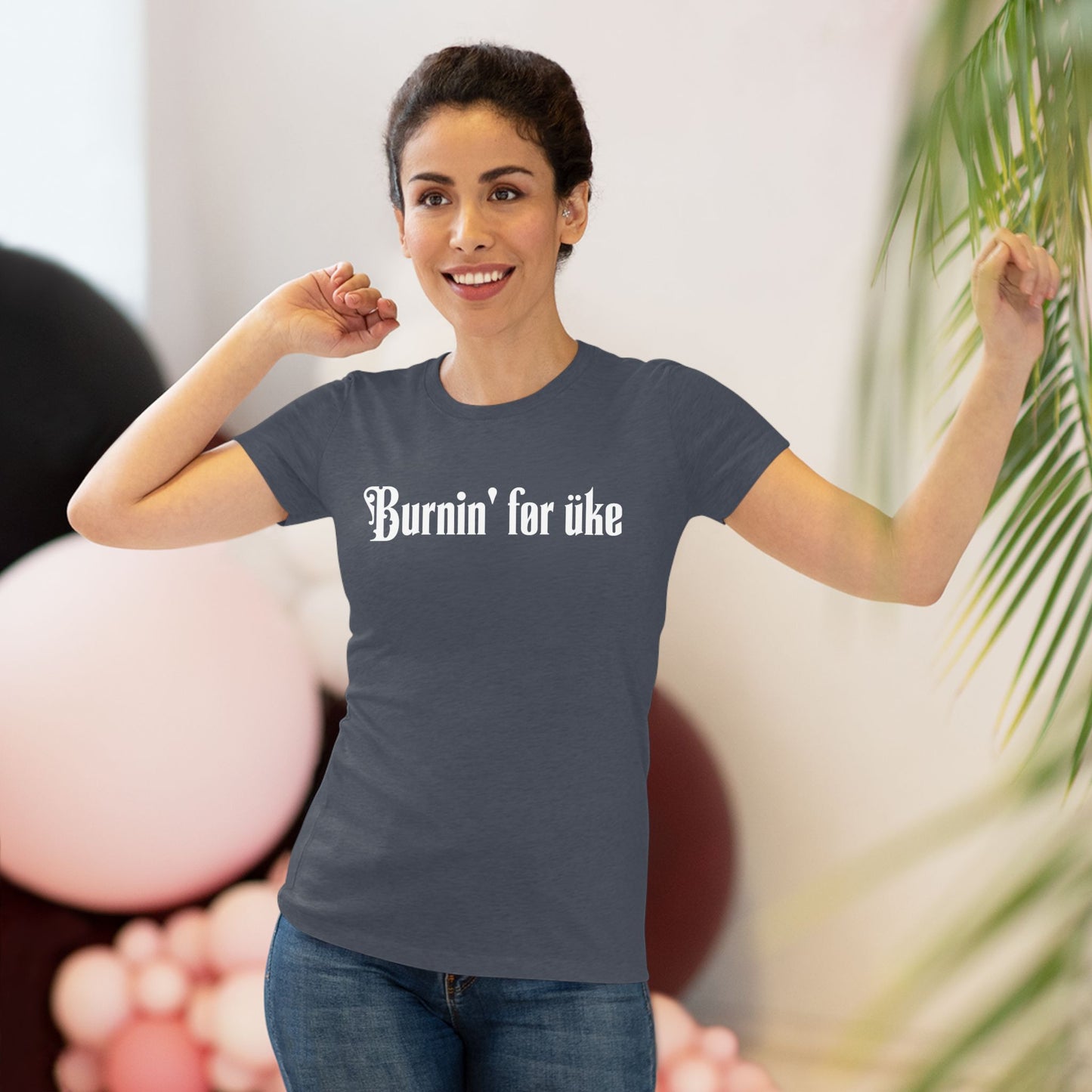 Woman wearing a heathered navy t-shirt with 'Burnin' for uke' in white Gothic letters printed on it.