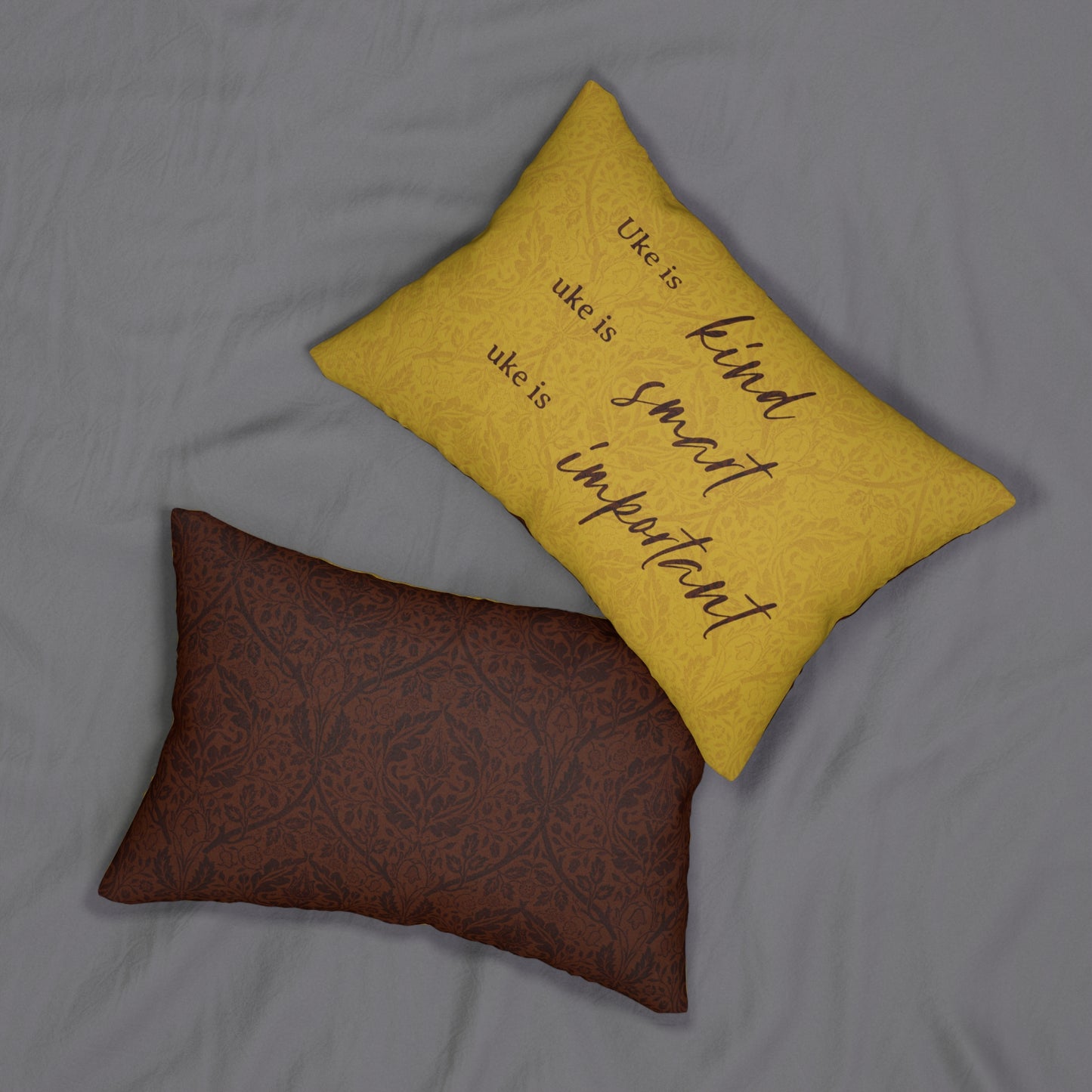 The front and back of the pillow, showing the text graphic on the front only.