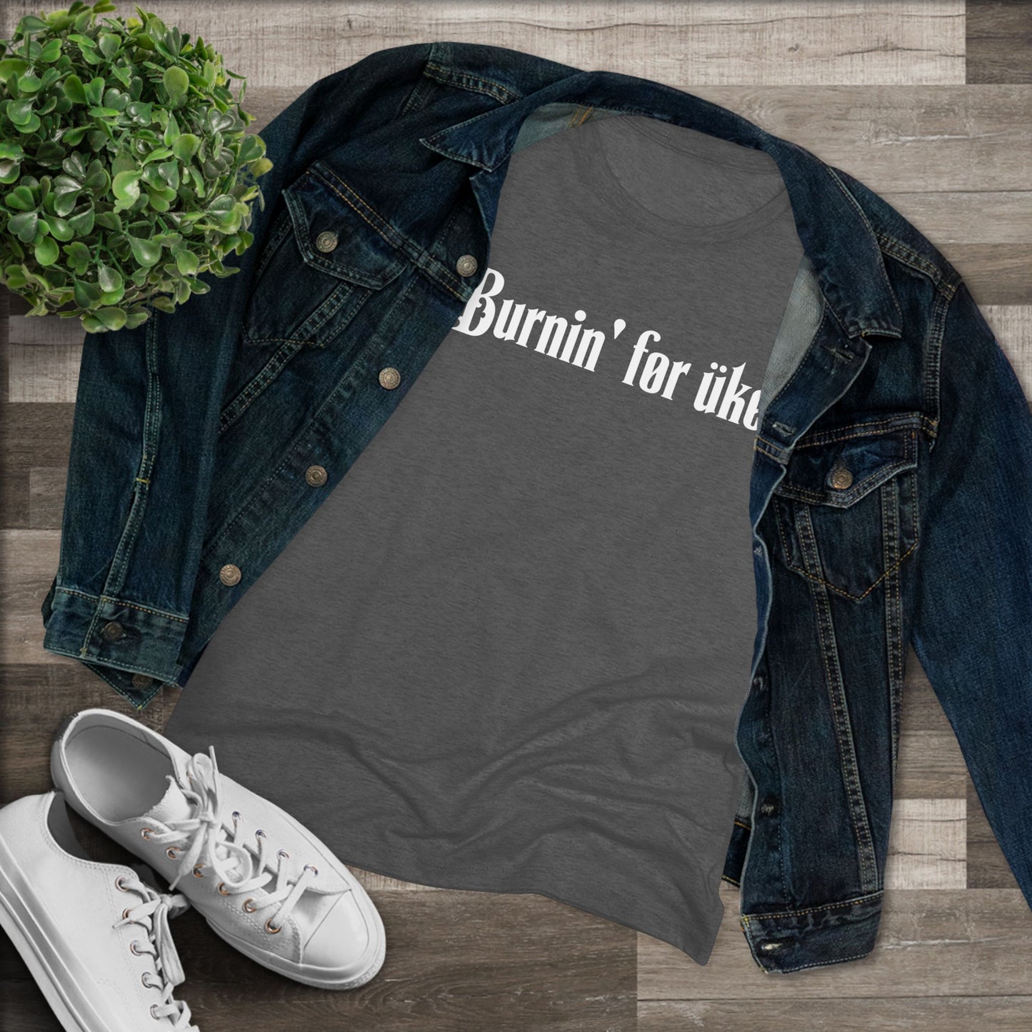 Heathered black t-shirt with 'Burnin' for uke' in white Gothic letters printed on it, styled with a denim jacket and white sneakers.