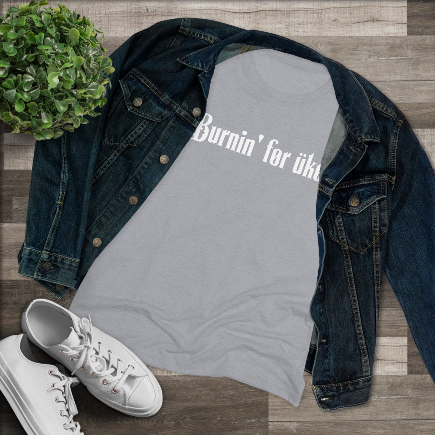 Grey t-shirt with 'Burnin' for uke' in white Gothic letters printed on it, styled with a denim jacket and white sneakers.