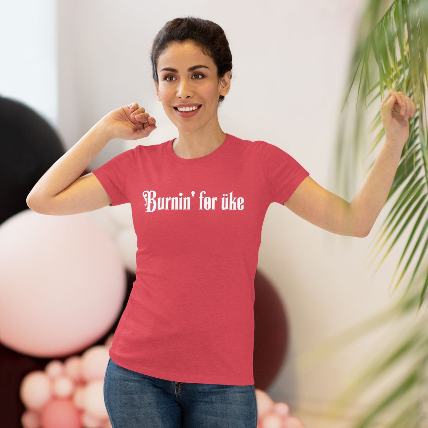 Woman wearing a red t-shirt with 'Burnin' for uke' in white Gothic letters printed on it.