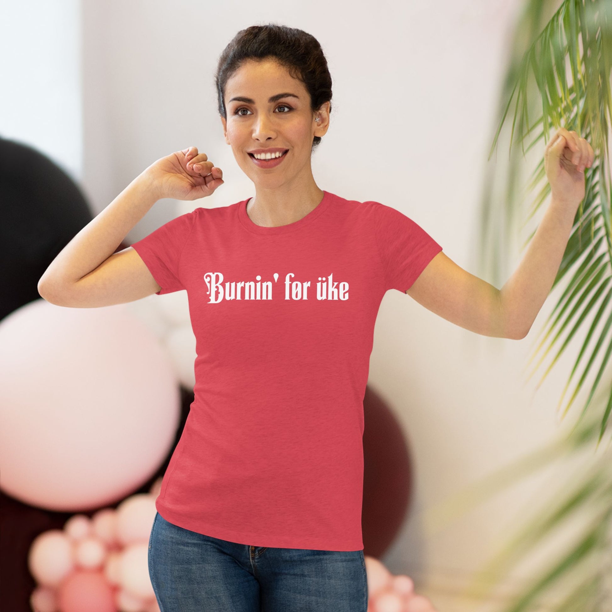 Woman wearing a red t-shirt with 'Burnin' for uke' in white Gothic letters printed on it.