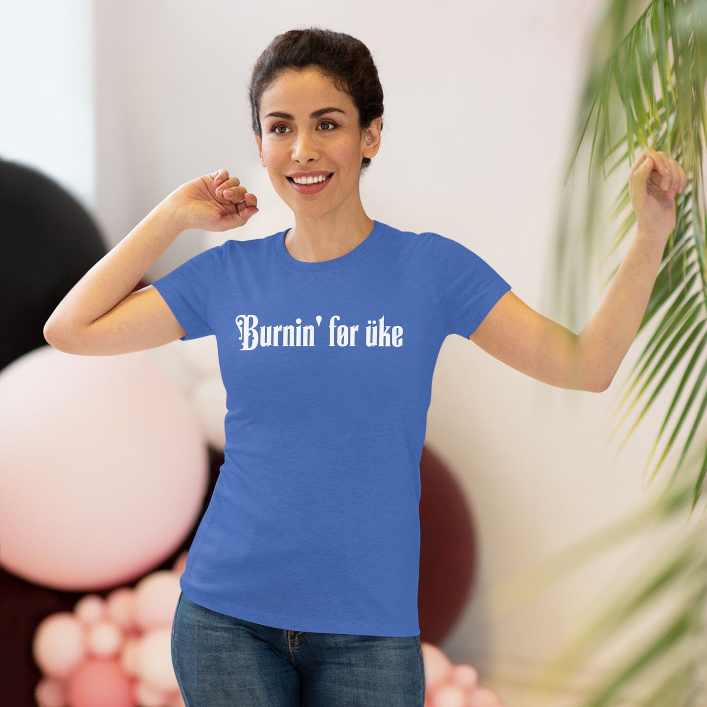 Woman wearing a royal blue t-shirt with 'Burnin' for uke' in white Gothic letters printed on it.