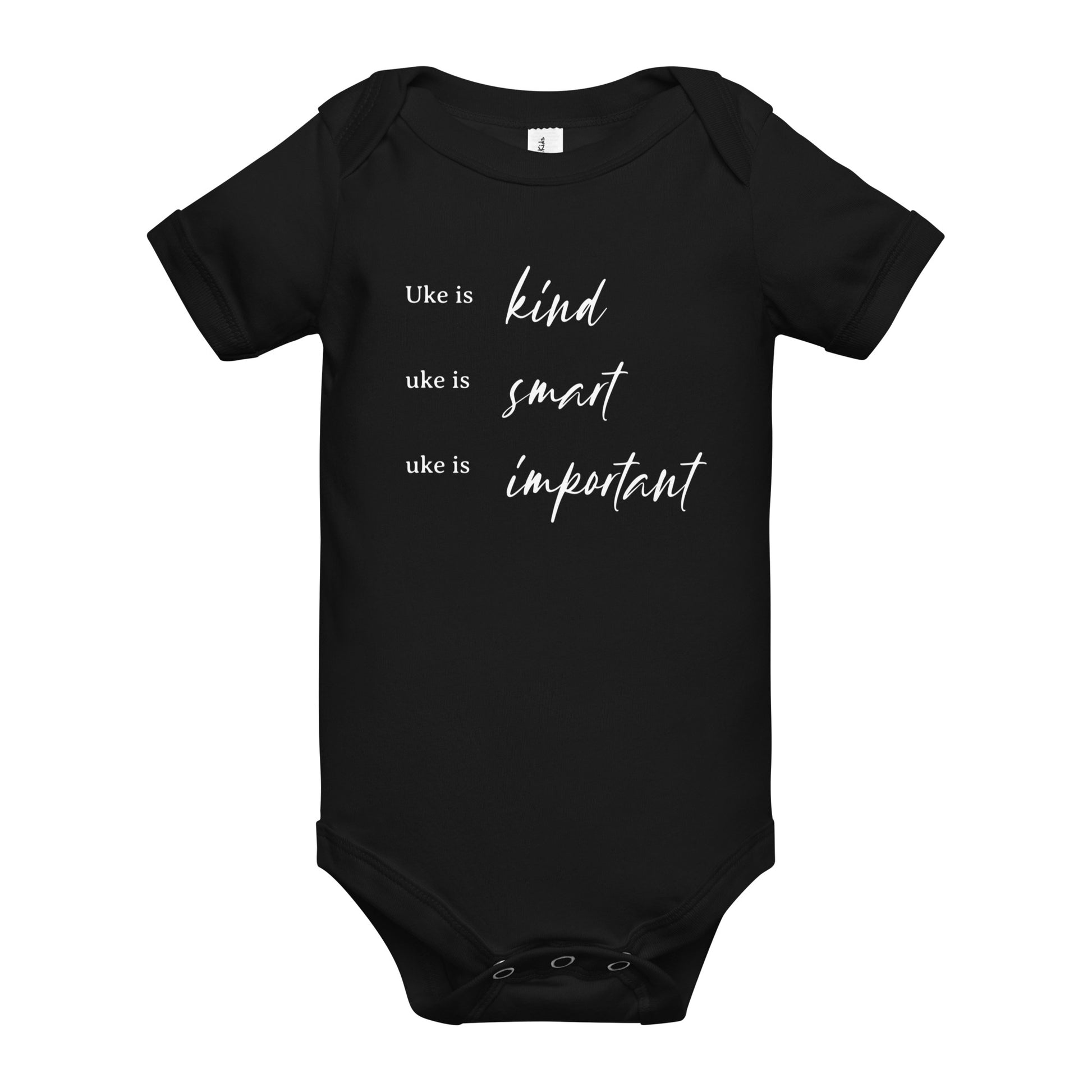 A black onesie printed with 'Uke is kind, uke is smart, uke is important' in white letters.