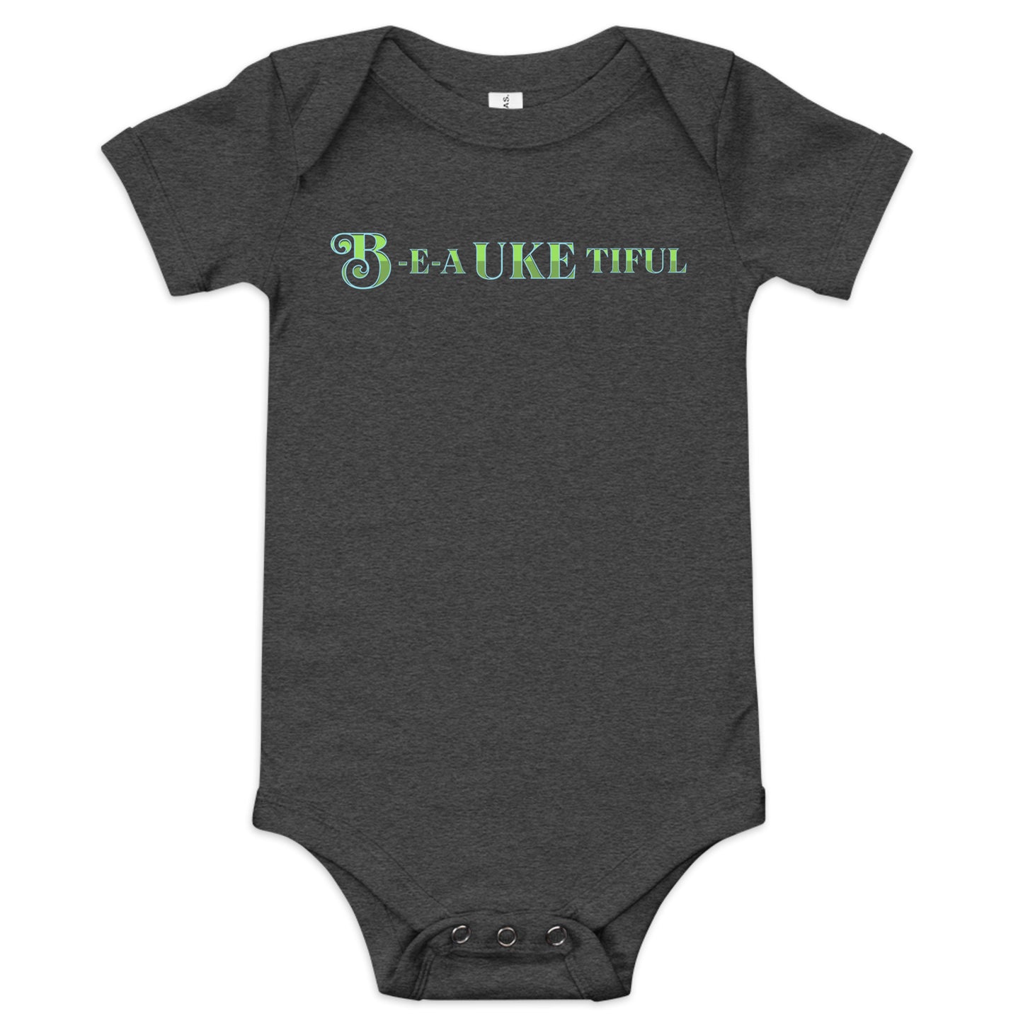 Dark grey baby onesie with ‘B-E-A-UKE-tiful’ printed in green block letters with a decorative letter B.