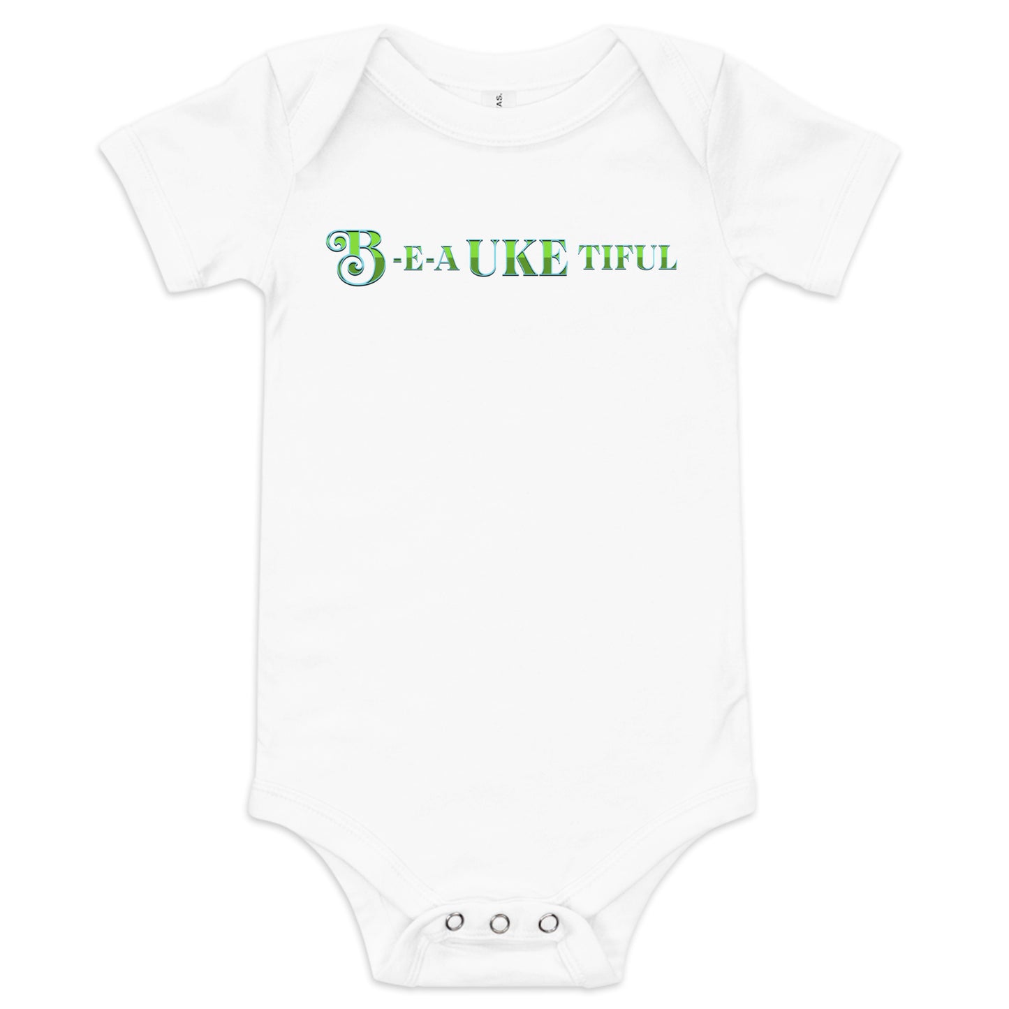 White baby onesie with ‘B-E-A-UKE-tiful’ printed in green block letters with a decorative letter B.