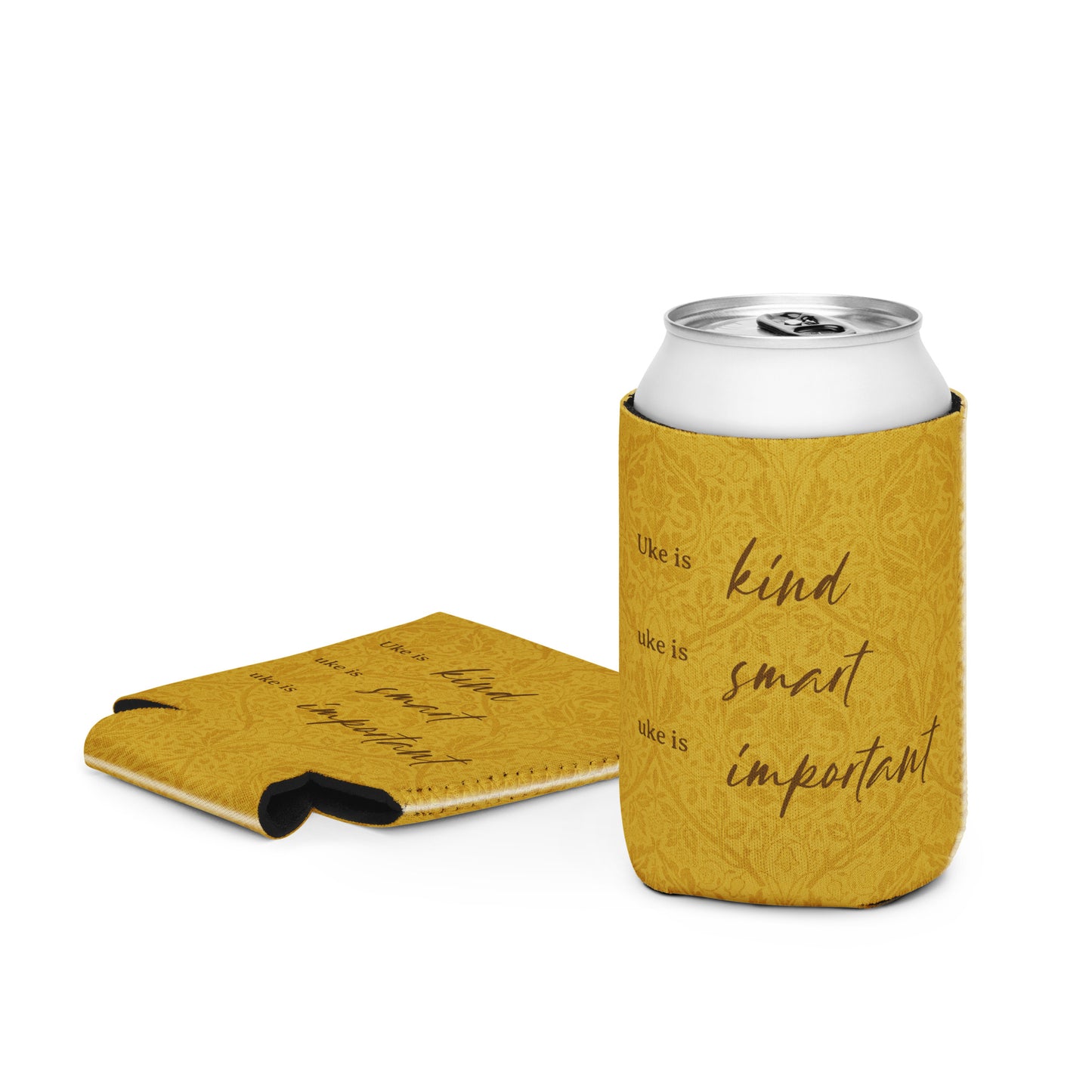 Regular-sized can coozie with a mustard-colored, patterned background and 'Uke is kind, uke is smart, uke is important' printed on it.