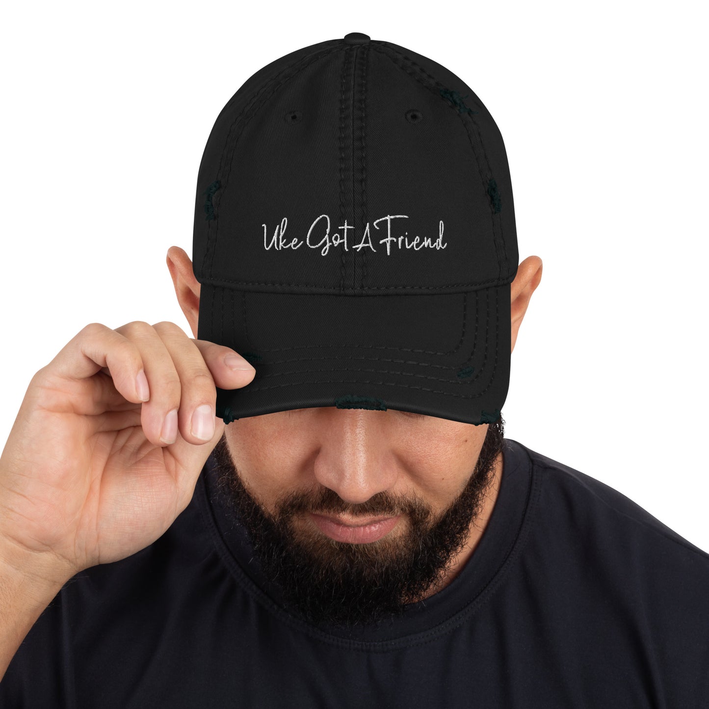 Black baseball cap with a distressed look and 'Uke Got A Friend' embroidered on it with white thread.
