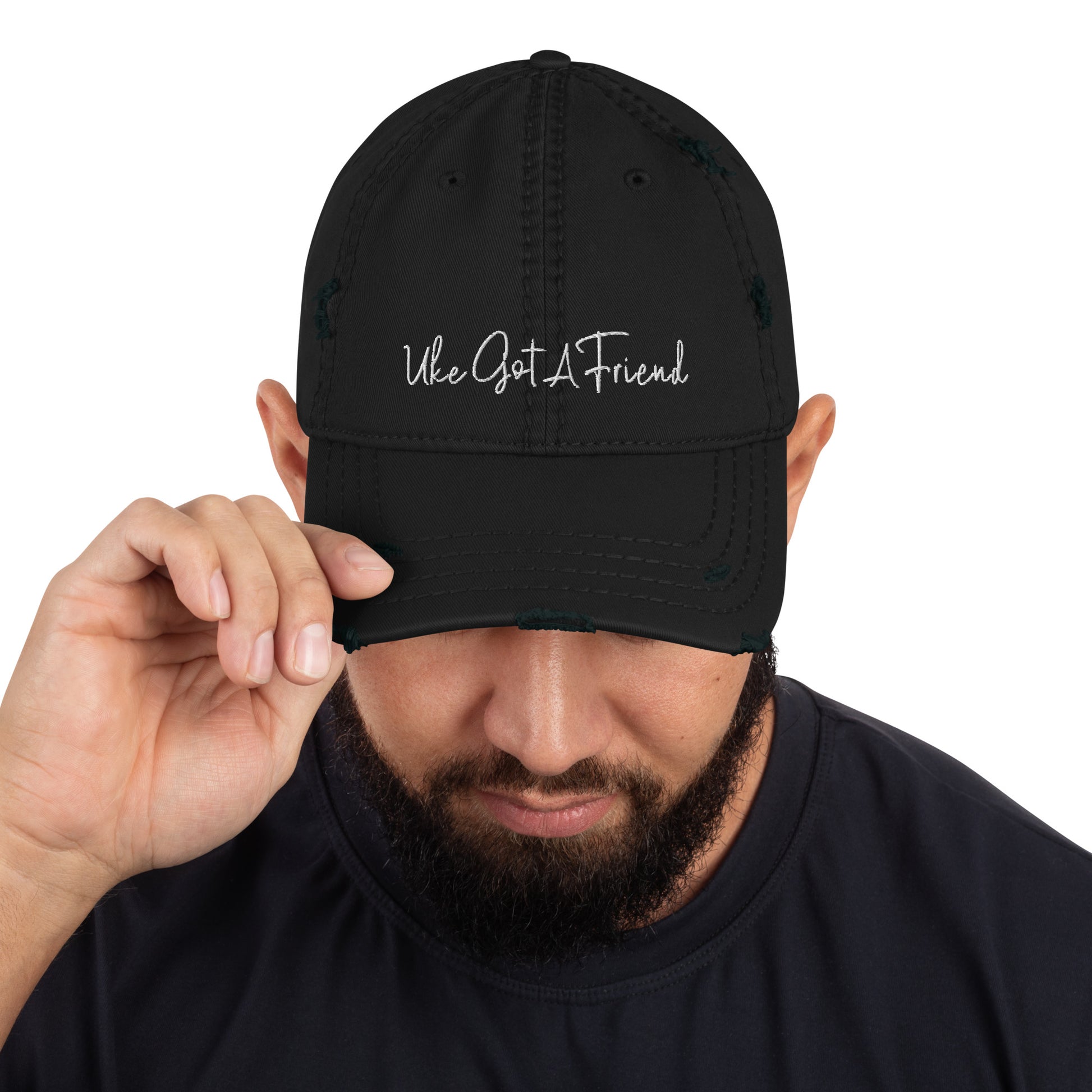 Black baseball cap with a distressed look and 'Uke Got A Friend' embroidered on it with white thread.
