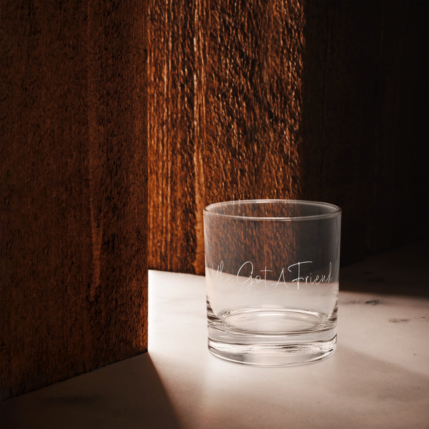 A rocks glass with 'Uke Got A Friend' printed on it.