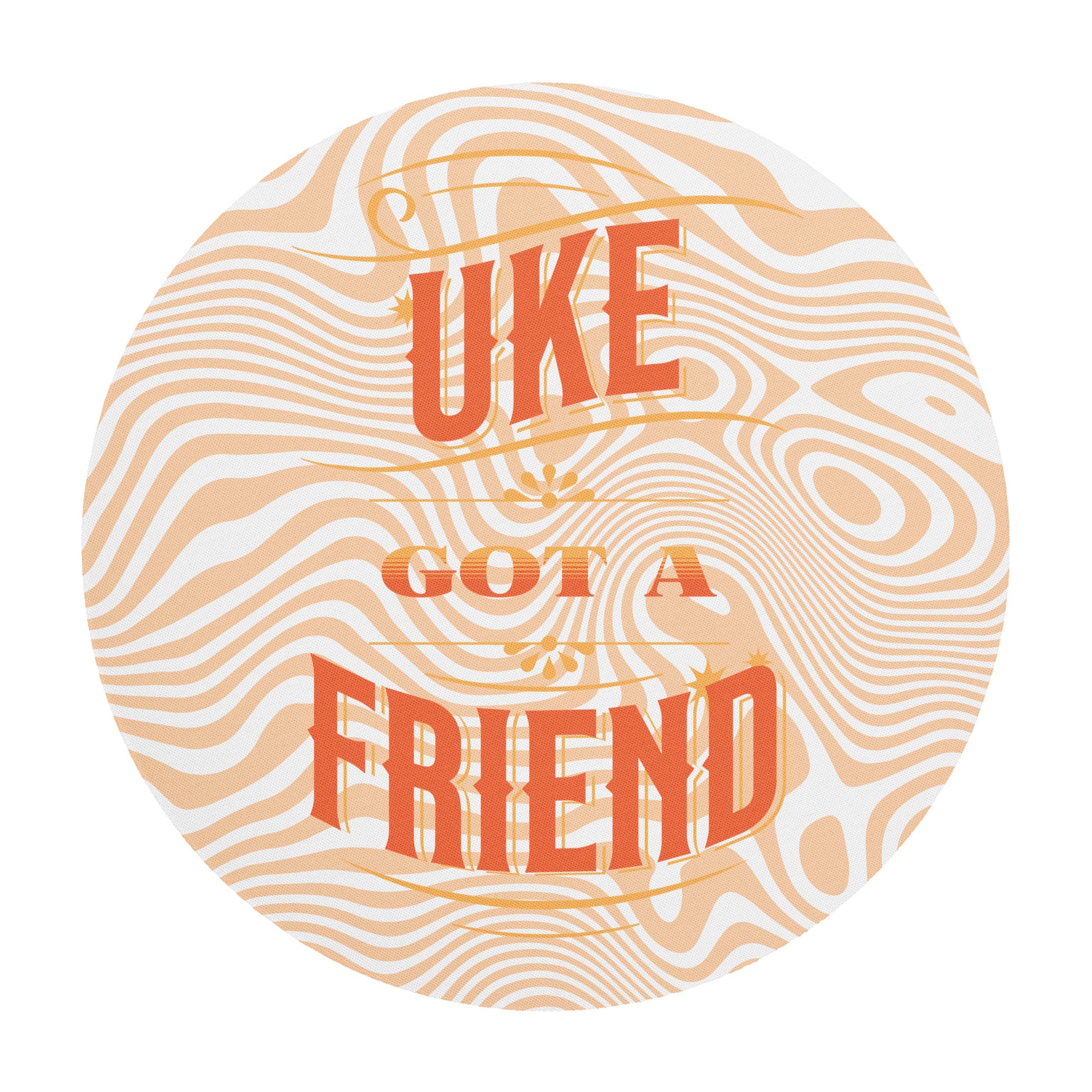 Round mouse pad with 'Uke Got A Friend' printed on it in orange and yellow block letters with a swirly design in the background.