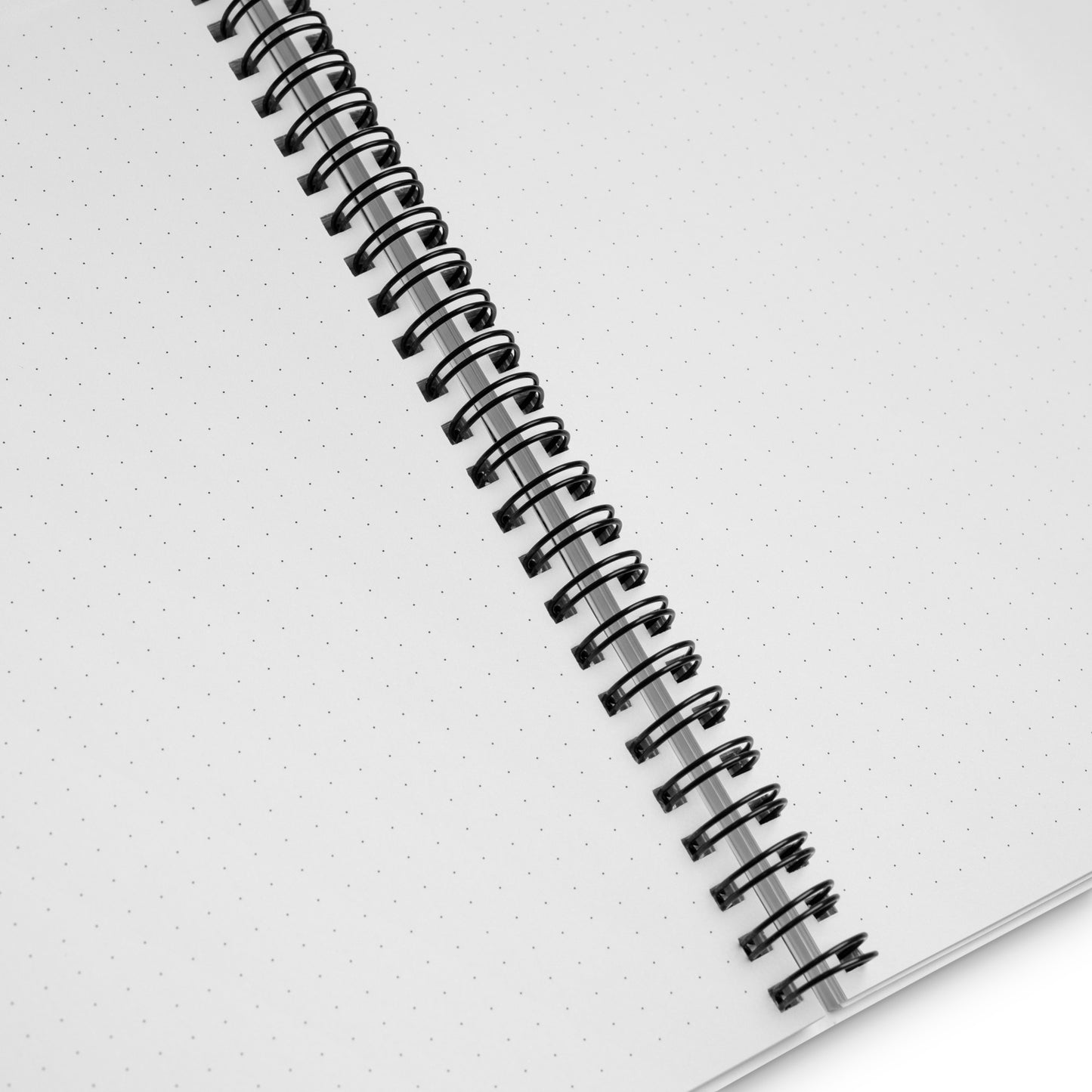 Close-up of the wire binding and dotted lines of the inside of a notebook.