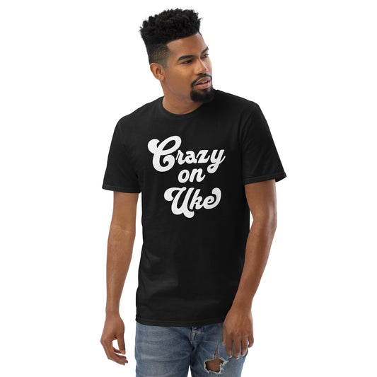 Man wearing a black t-shirt with 'Crazy On Uke' in white cursive text.
