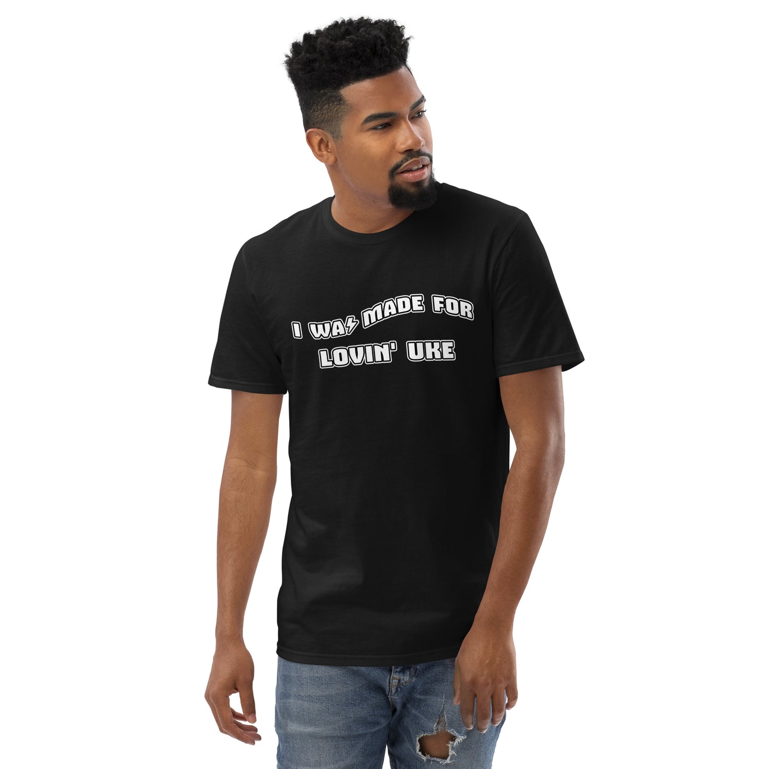 Man wearing a black t-shirt with 'I was made for lovin' uke' printed in black and white block letters.
