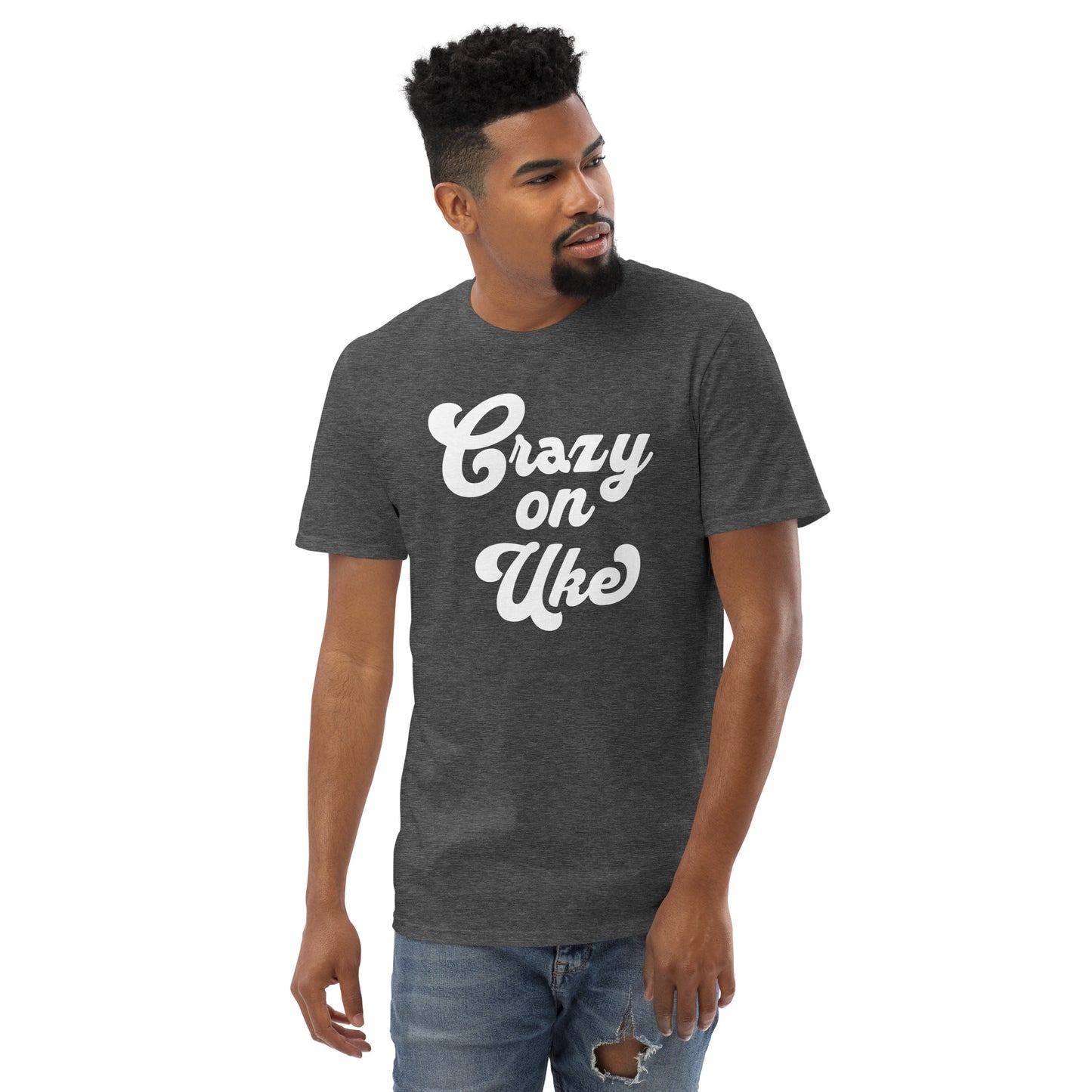 Man wearing a dark grey t-shirt with 'Crazy On Uke' in white cursive text.