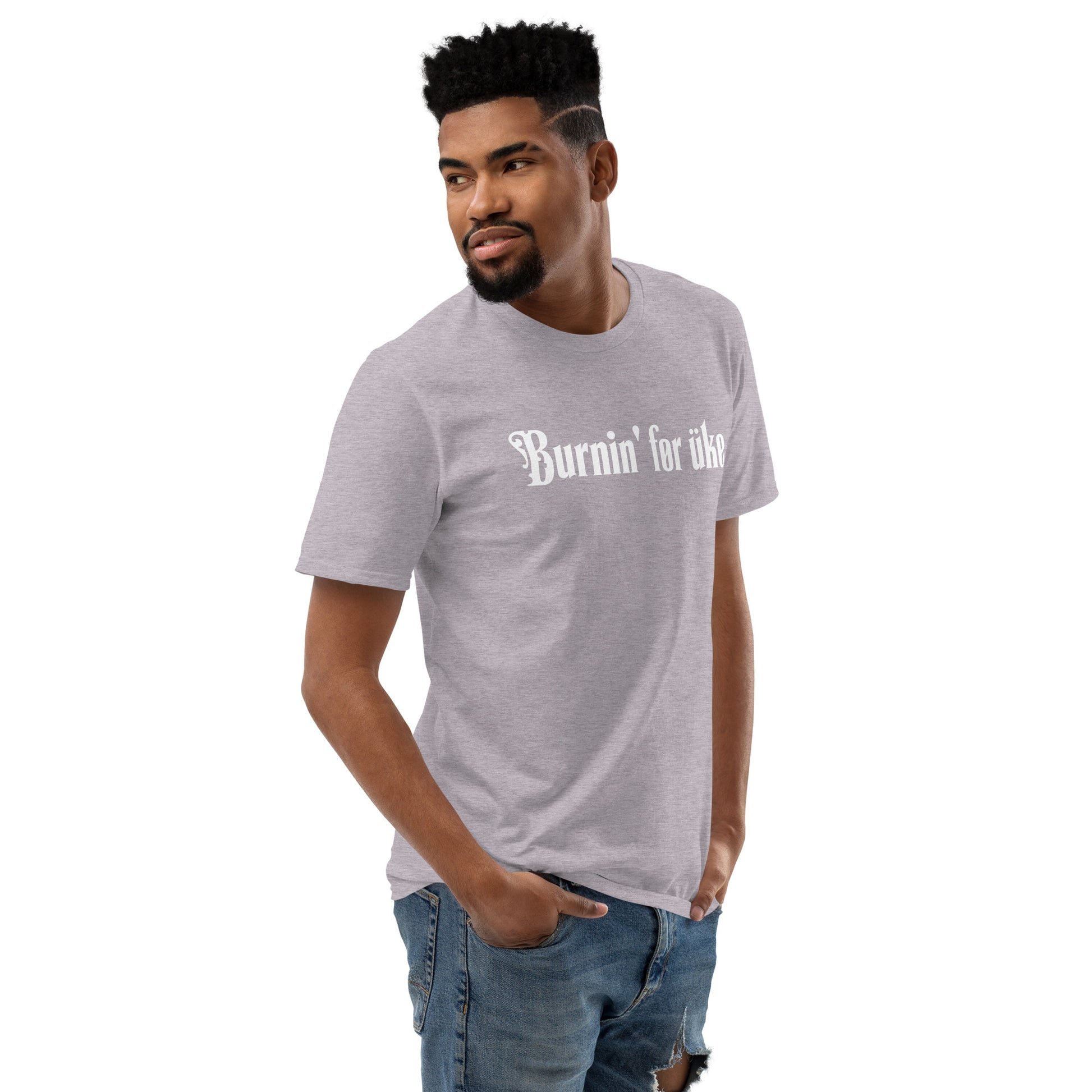 Man wearing a grey t-shirt with 'Burnin' for uke' in white Gothic letters printed on it.