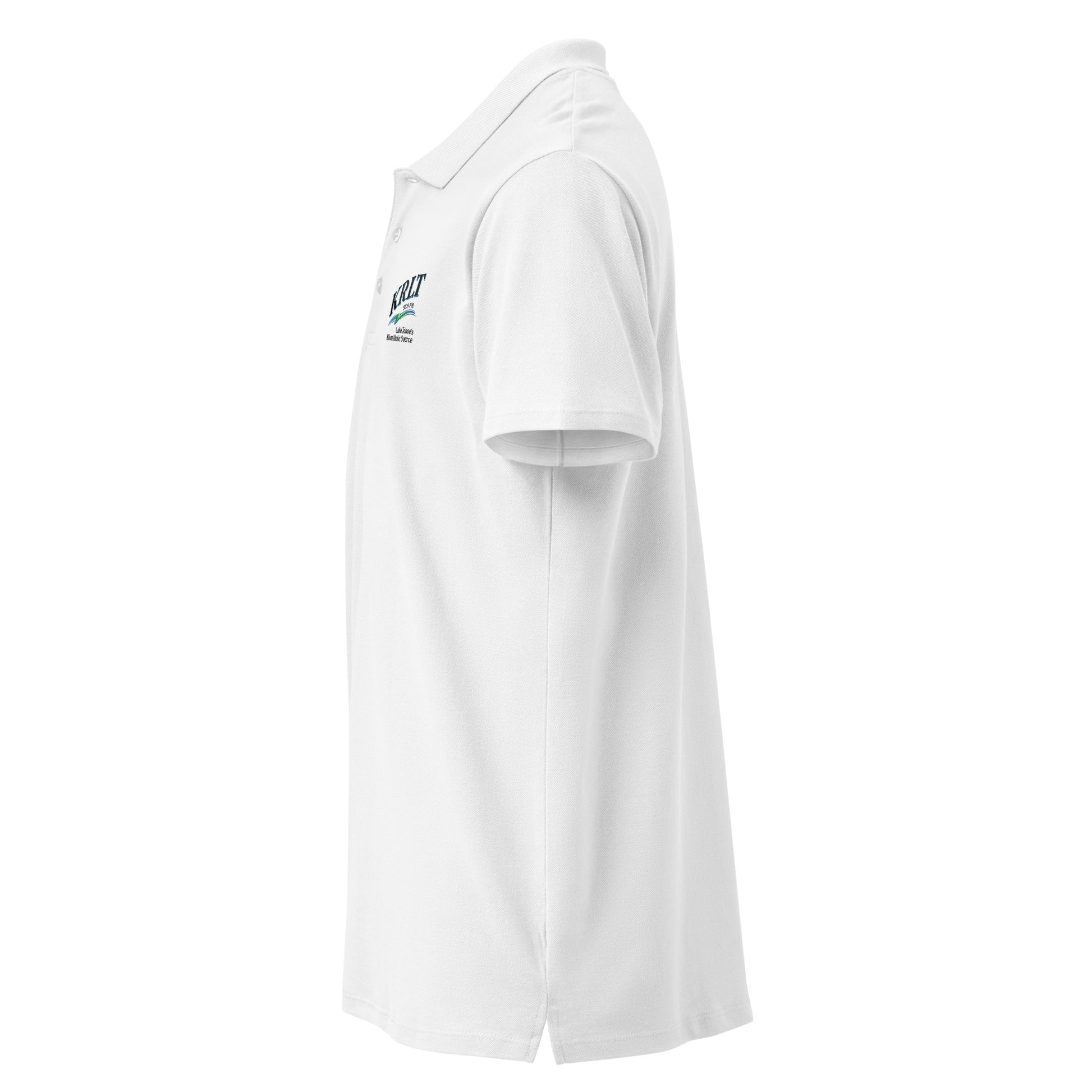 Side view of a white golf shirt with the KRLT logo in black, blue, and green, placed on the left upper-chest (right sleeve hidden from view).