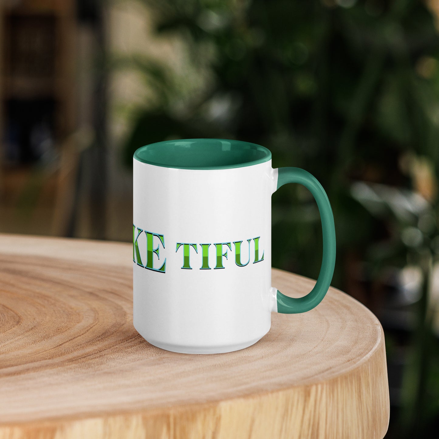 15-ounce white mug with dark green handle and inside, with ‘B-E-A-UKE-tiful’ printed across the mug from one side of the handle to the other.