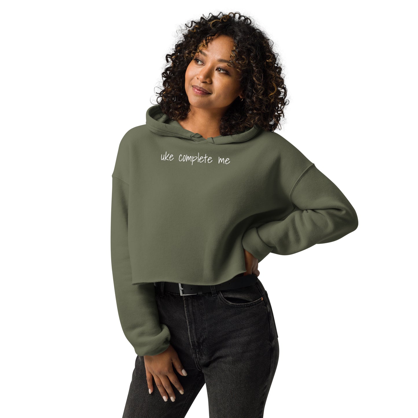 Woman wearing a Military Green cropped hoodie with 'uke complete me' written in white text.