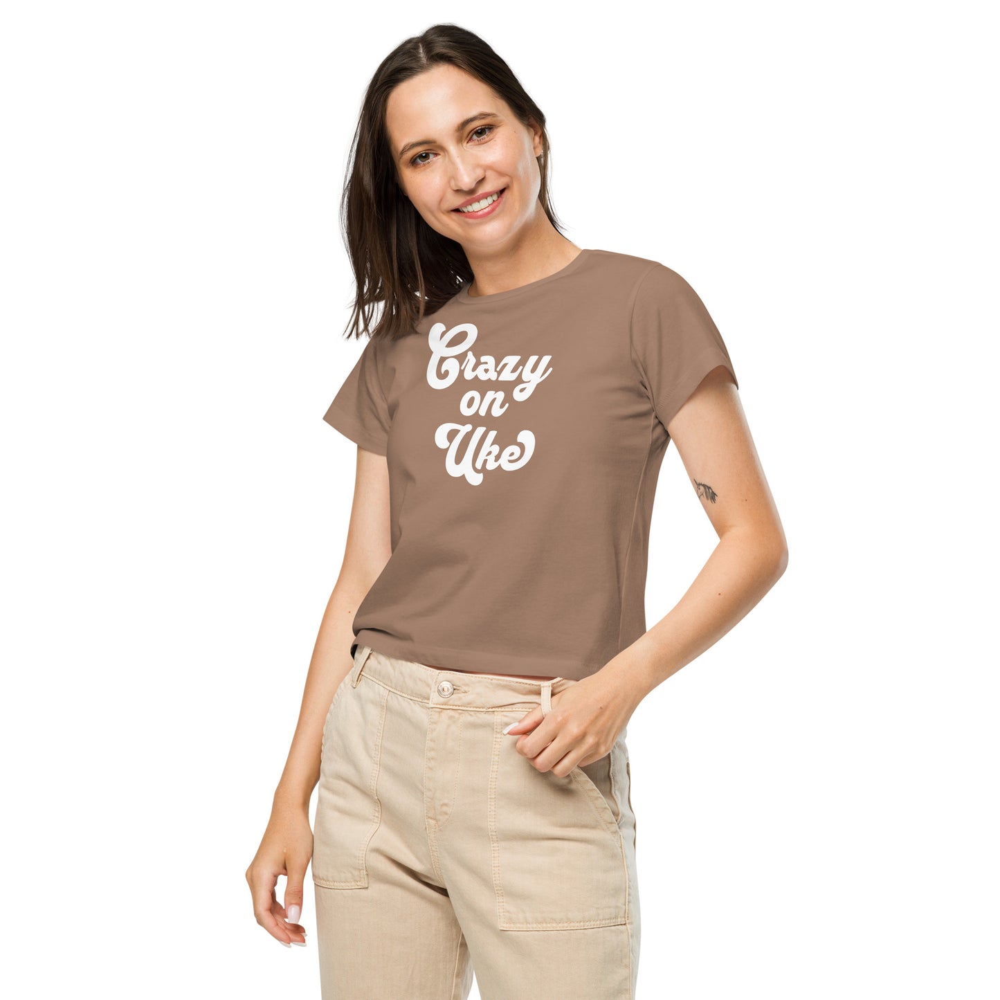 Woman wearing a latte-brown high-waisted t-shirt with 'Crazy On Uke' in white cursive text.