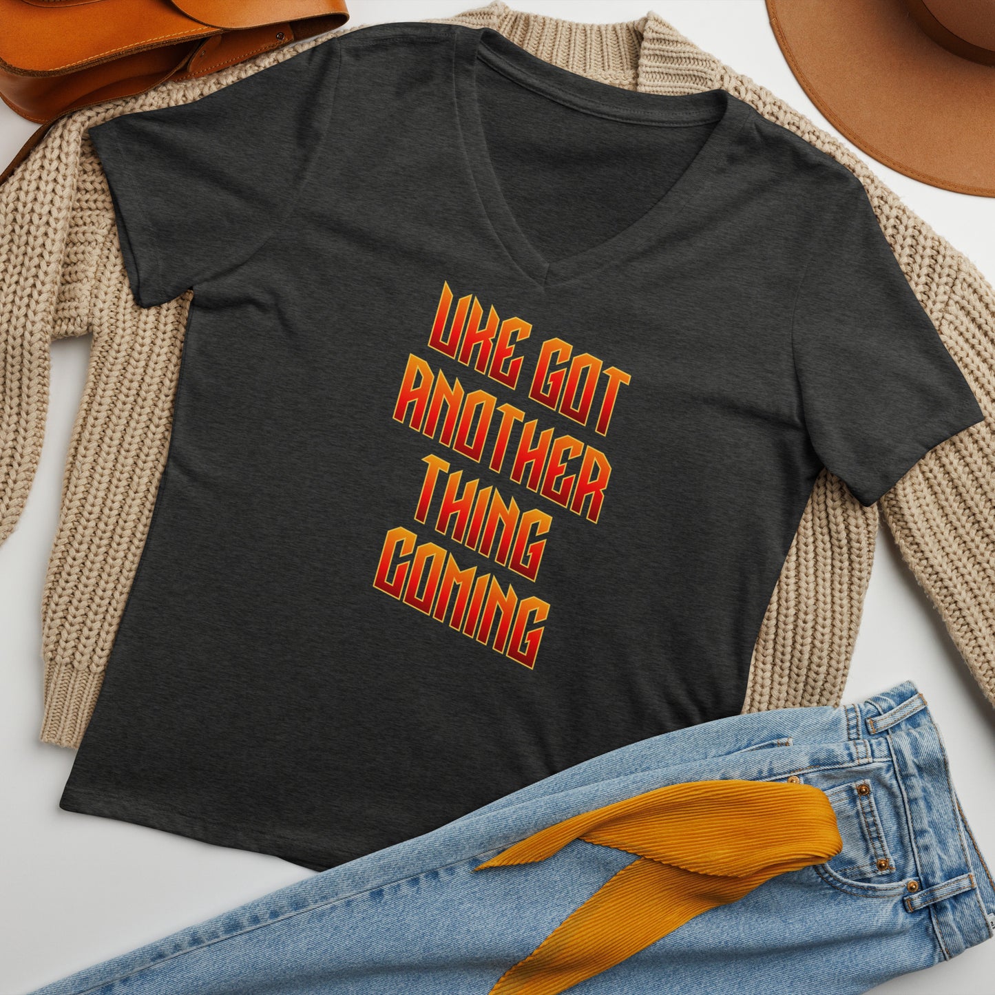 Dark grey v-neck t-shirt printed with 'Uke Got Another Thing Coming' in orange and yellow slanted block letters.