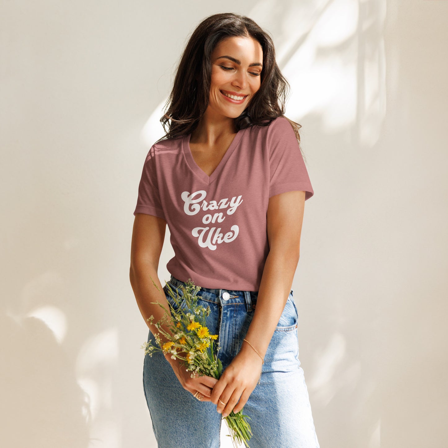Woman wearing a heather mauve v-neck t-shirt with 'Crazy On Uke' in white cursive text.