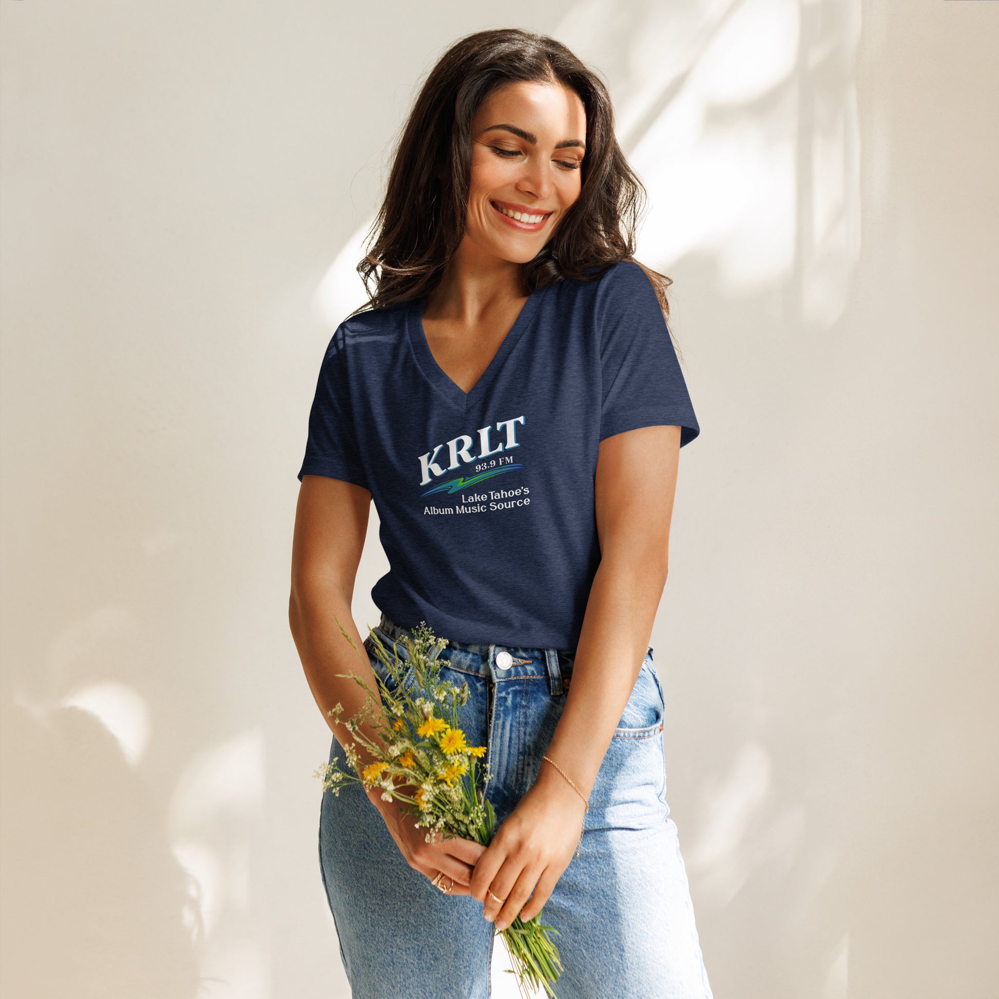Women's Heather Navy Blue v-neck t-shirt with square, centered KRLT logo in white, blue, and green.