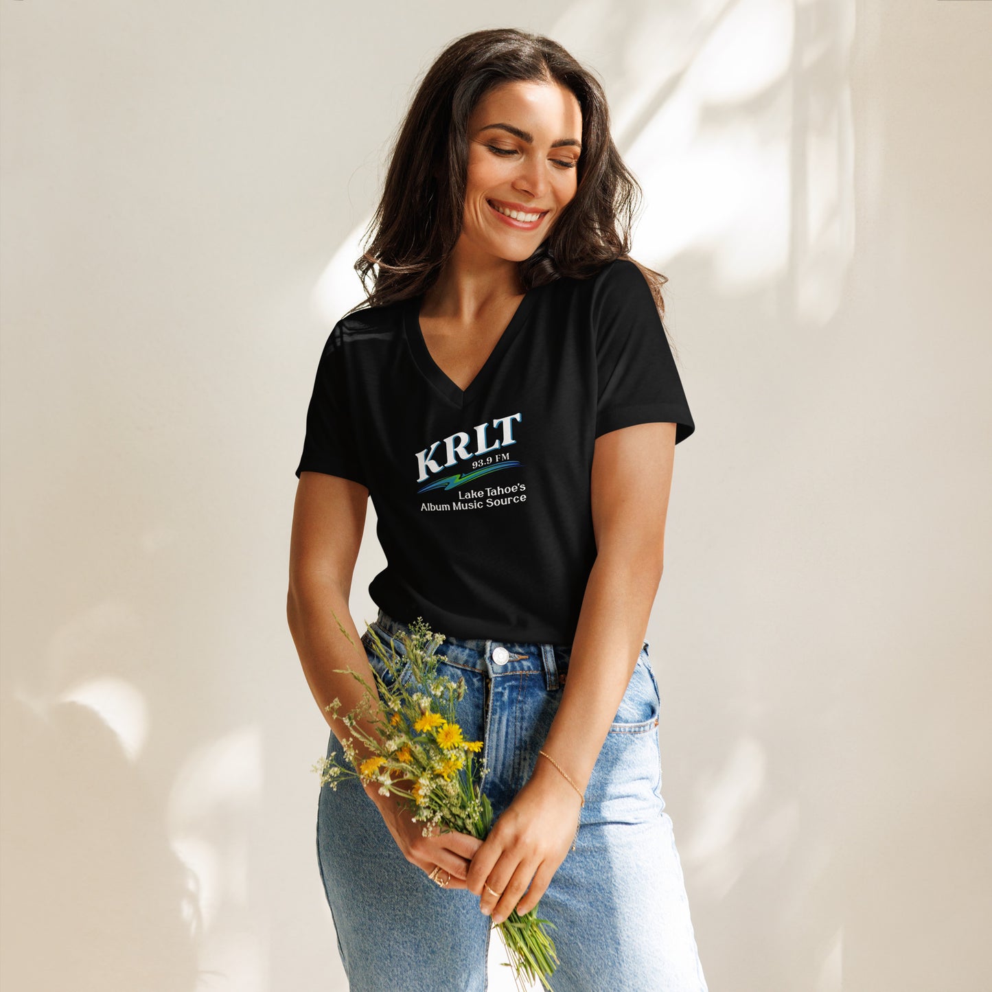 Women's Black v-neck t-shirt with square, centered KRLT logo in white, blue, and green.