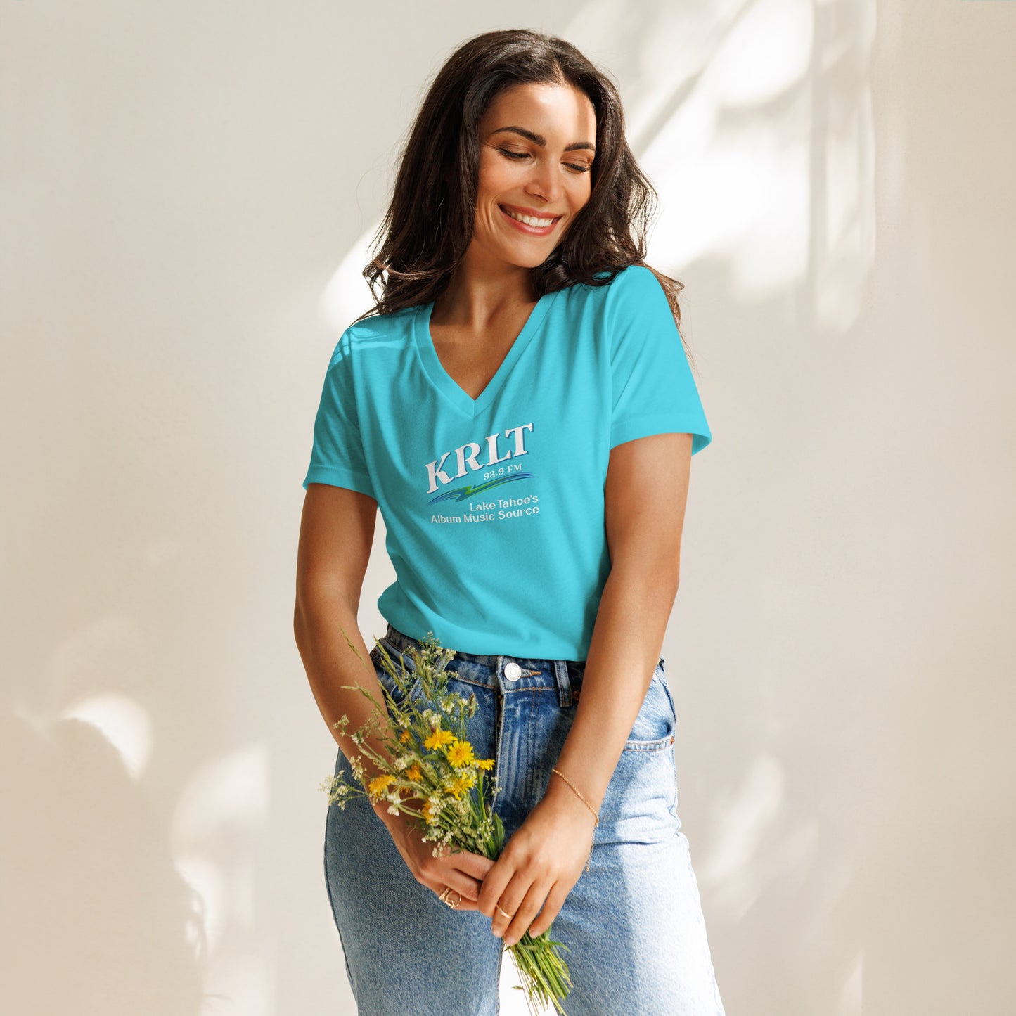 Women's Turquoise v-neck t-shirt with square, centered KRLT logo in white, blue, and green.